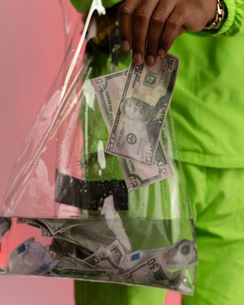 A creative studio shot of dollar banknotes in water, symbolizing financial instability or laundering.